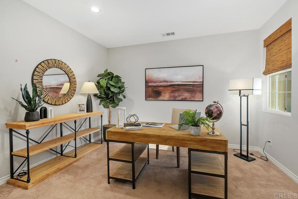 33802 Edge Lane Temecula, CA 92592 - Photo 17 of 31 a living room with furniture a rug and a potted plant