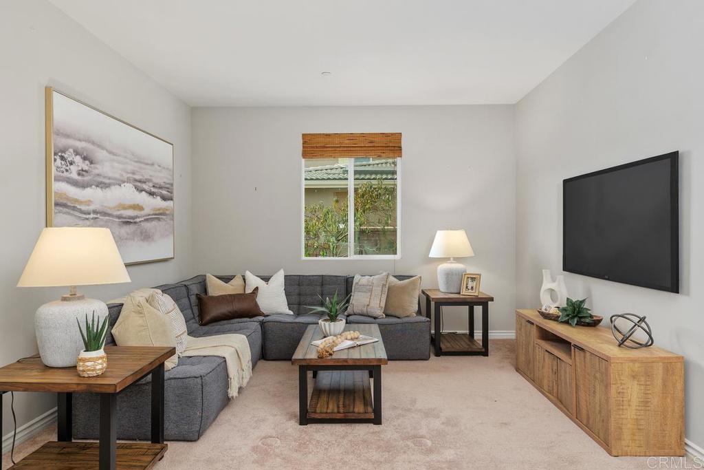 33802 Edge Lane Temecula, CA 92592 - Photo 18 of 31 a living room with furniture and a flat screen tv
