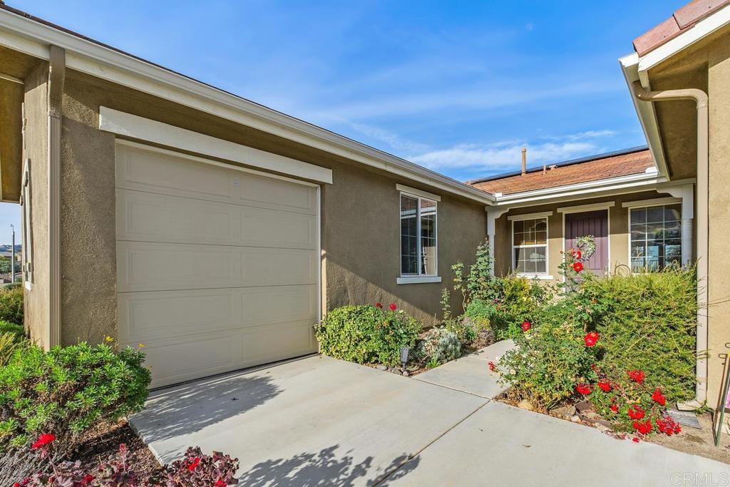 33802 Edge Lane Temecula, CA 92592 - Photo 2 of 31 a front view of house with flower garden
