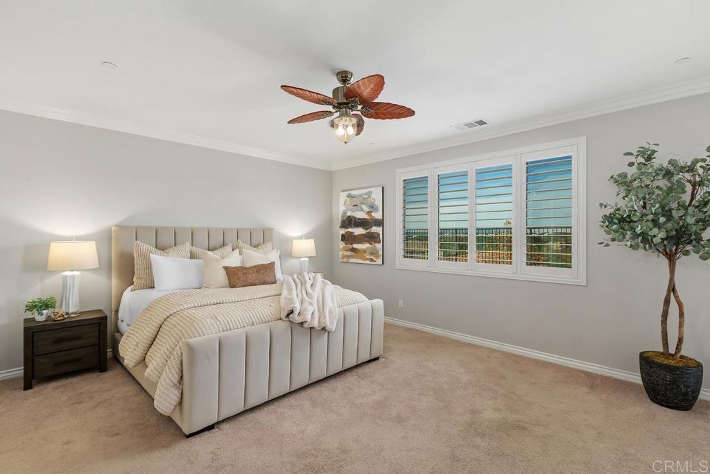 33802 Edge Lane Temecula, CA 92592 - Photo 22 of 31 a bedroom with a bed and potted plant with window