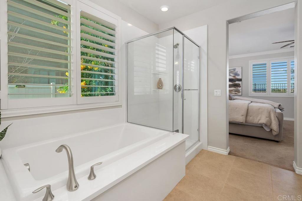 33802 Edge Lane Temecula, CA 92592 - Photo 26 of 31 a bathroom with a tub shower and window