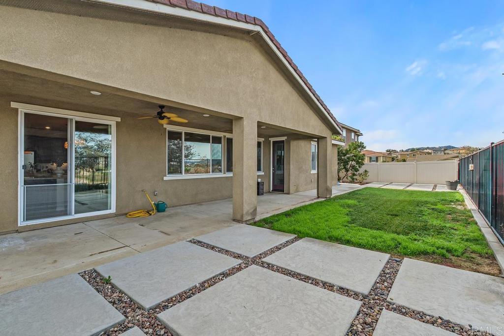 33802 Edge Lane Temecula, CA 92592 - Photo 28 of 31 a front view of a house with a yard and garage