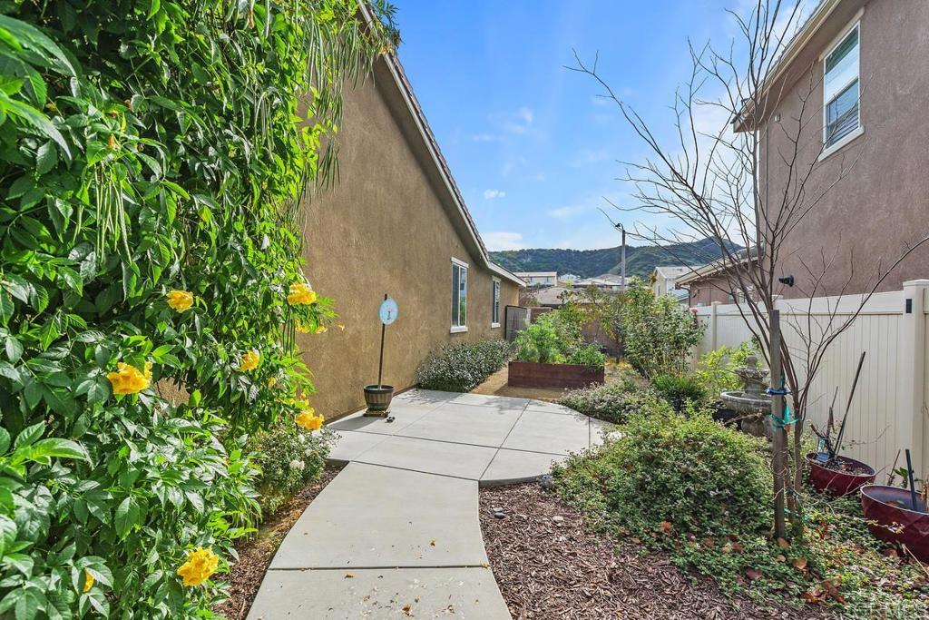 33802 Edge Lane Temecula, CA 92592 - Photo 29 of 31 a view of a pathway with a flower plants