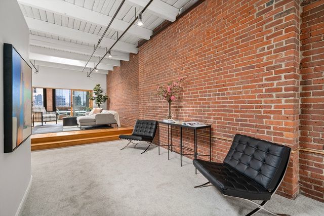 a view of livingroom with furniture and floor to ceiling window