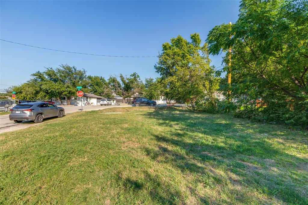 6691 Half Elm Street Frisco, TX 75034 - Photo 7 of 11 a view of yard with green space and trees in the background
