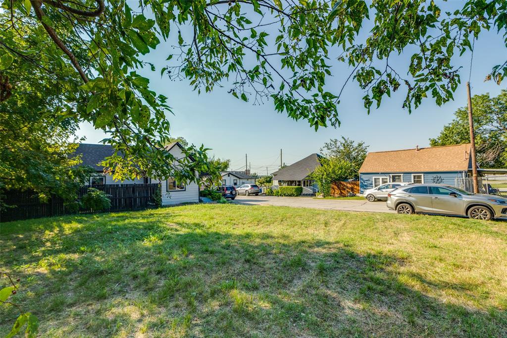 6691 Half Elm Street Frisco, TX 75034 - Photo 10 of 11 a swimming pool with yard and trees in the background