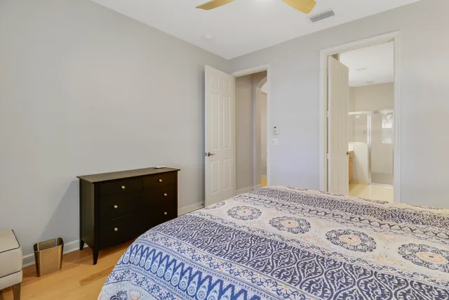 a bedroom with a bed and a dresser