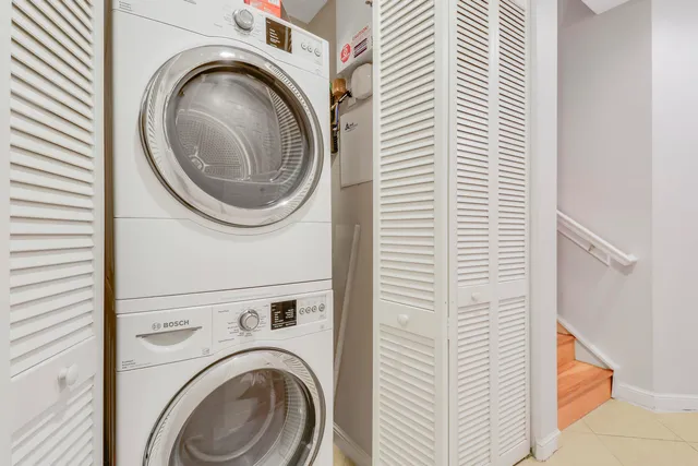 a view of a hallway with washer and dryer