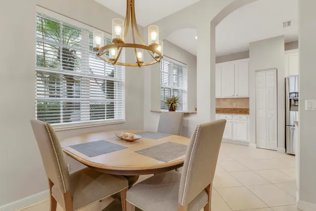 a view of a dining room with furniture window and outside view