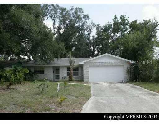 7611 Puritan Road Orlando, FL 32807 - Photo 1 of 1 a view of a house with a yard plants and large tree
