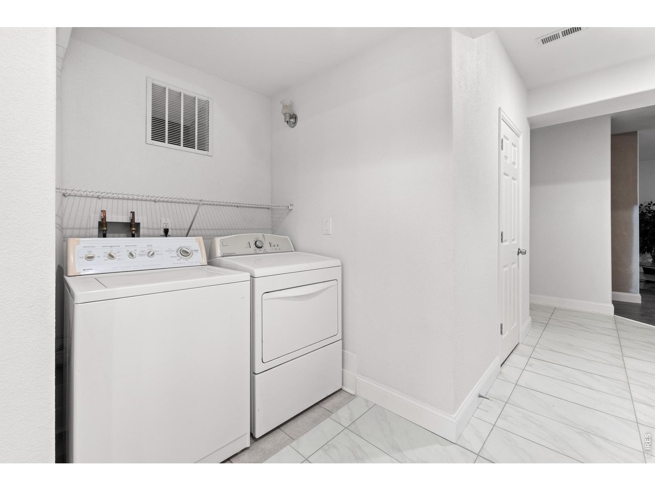 5726 Graphite Street Timnath, CO 80547 - Photo 26 of 49 a utility room with dryer and washer