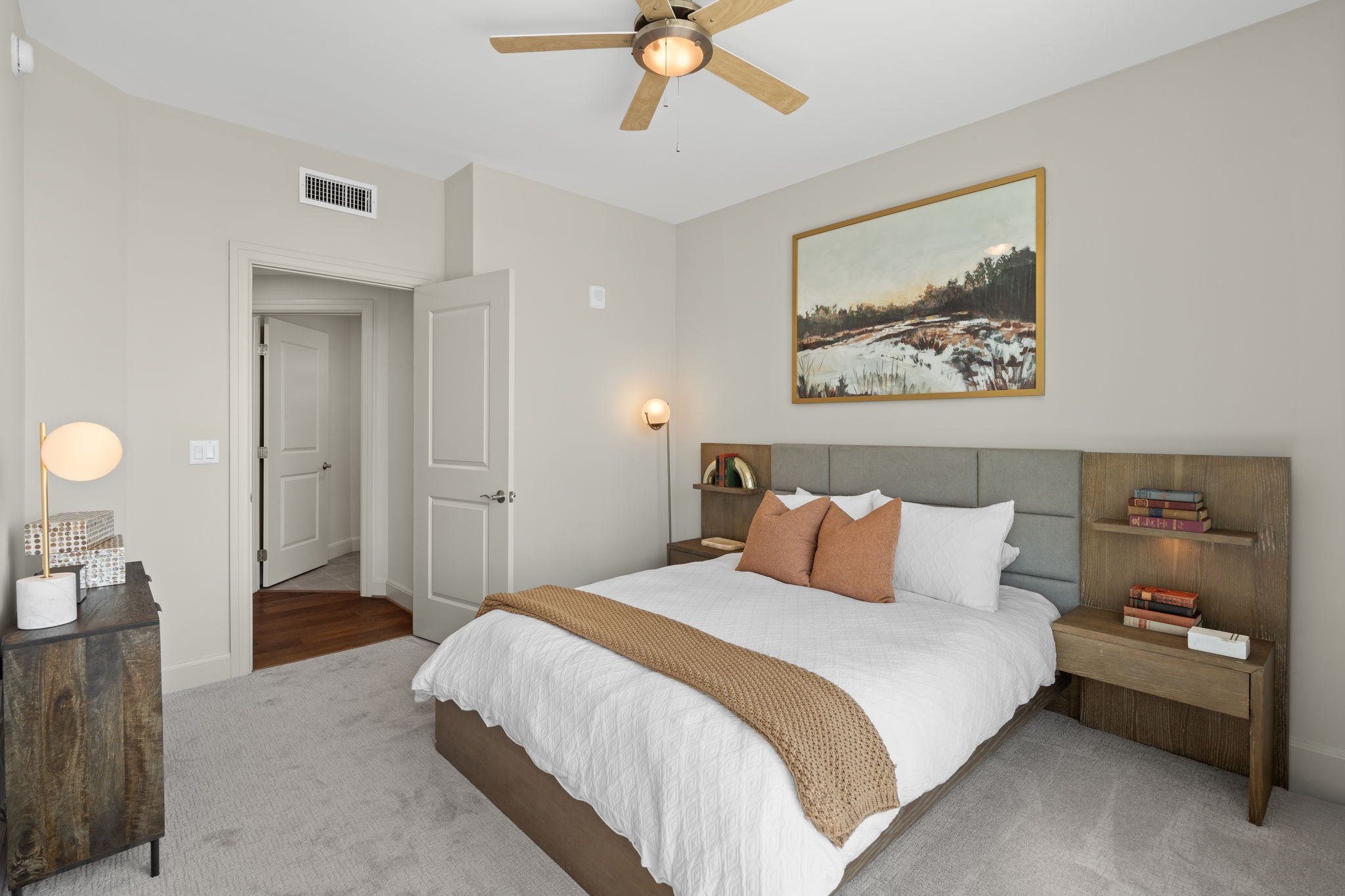 2511 Willowick Road, Unit 317 Houston, TX 77027 - Photo 11 of 44 a bedroom with a bed and a chandelier