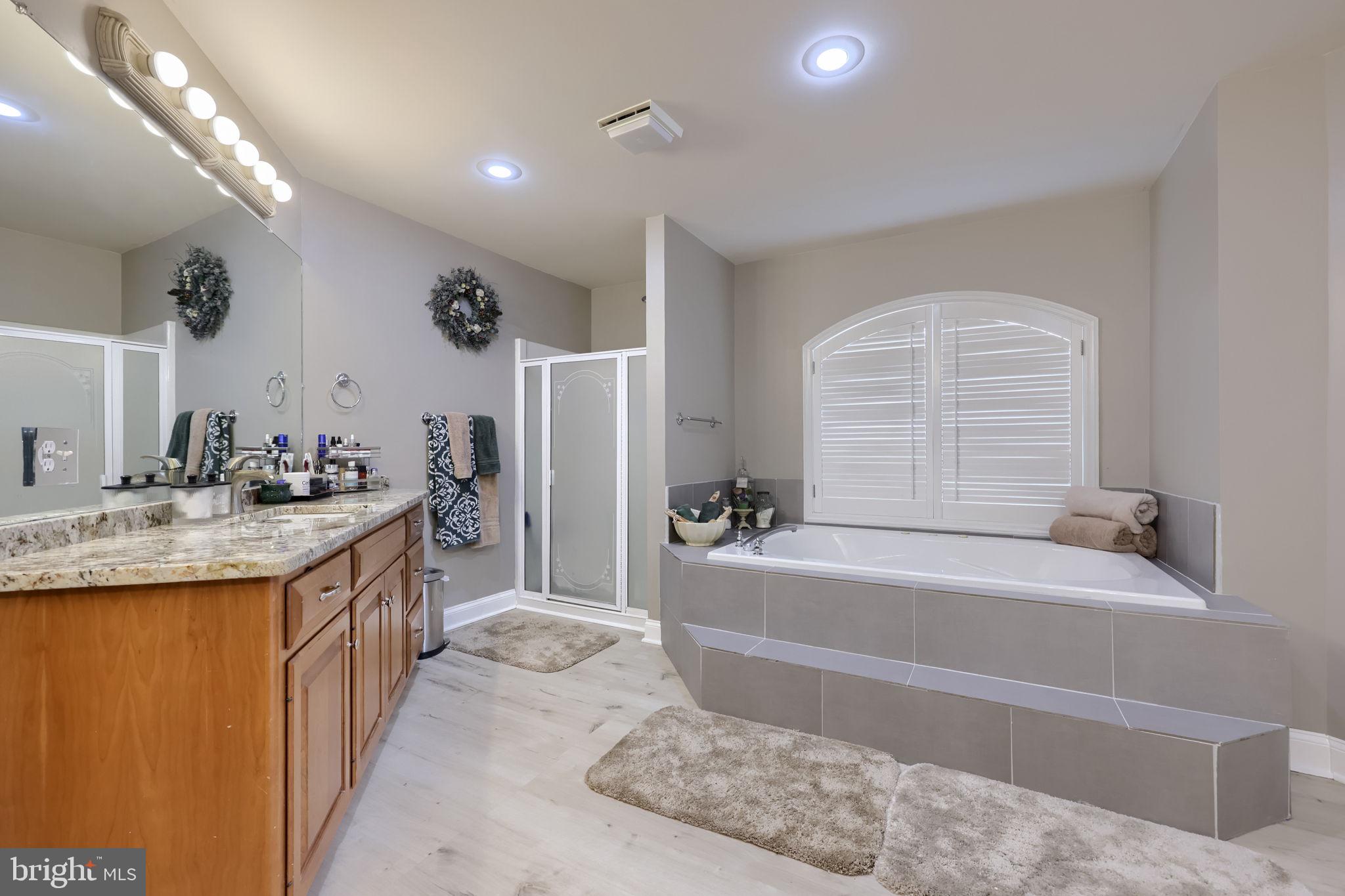 4972 Farmington Road Harrisburg, PA 17112 - Photo 24 of 57 a spacious bathroom with a tub sink and mirror
