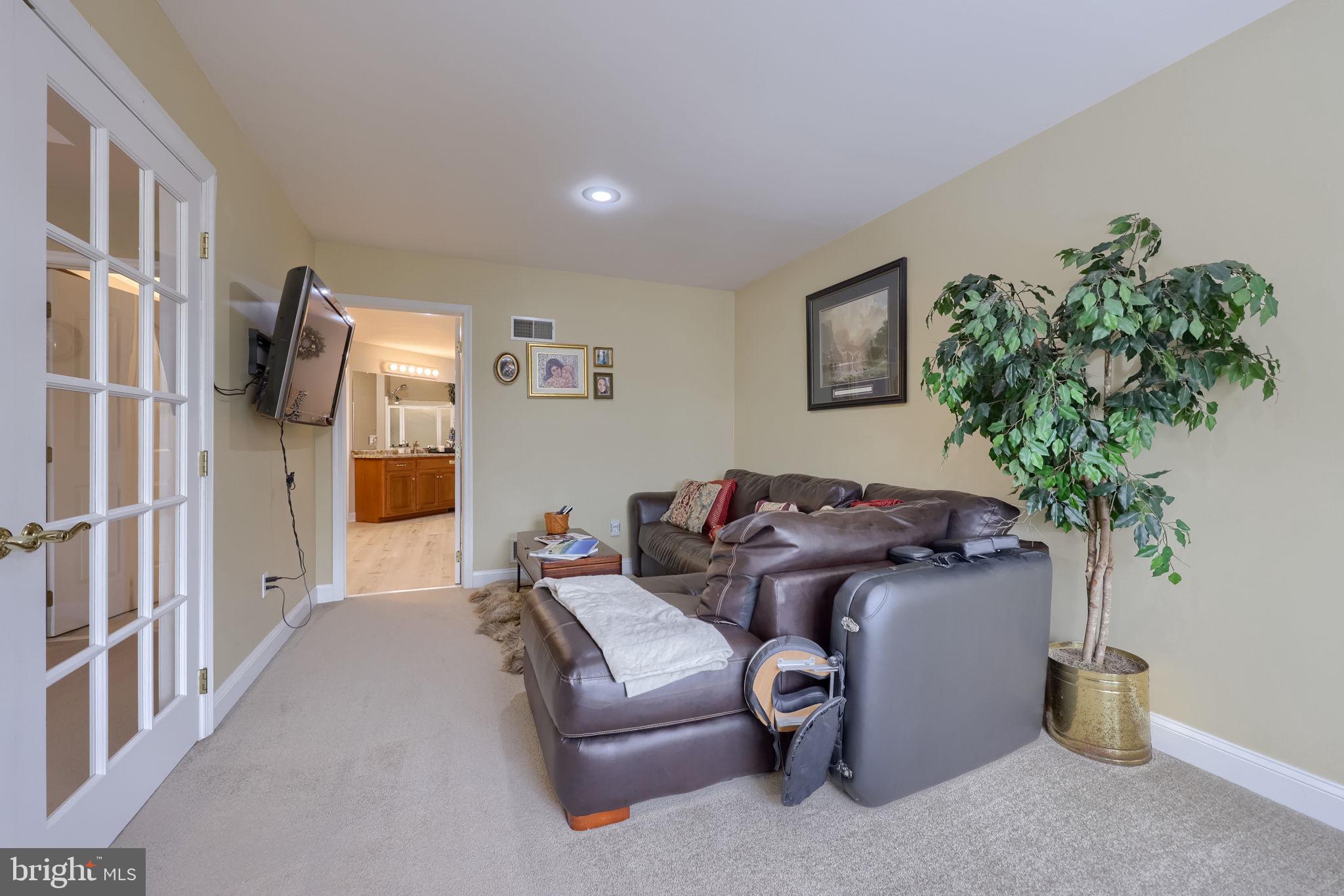 4972 Farmington Road Harrisburg, PA 17112 - Photo 29 of 57 a living room with furniture flowerpot and a potted plant