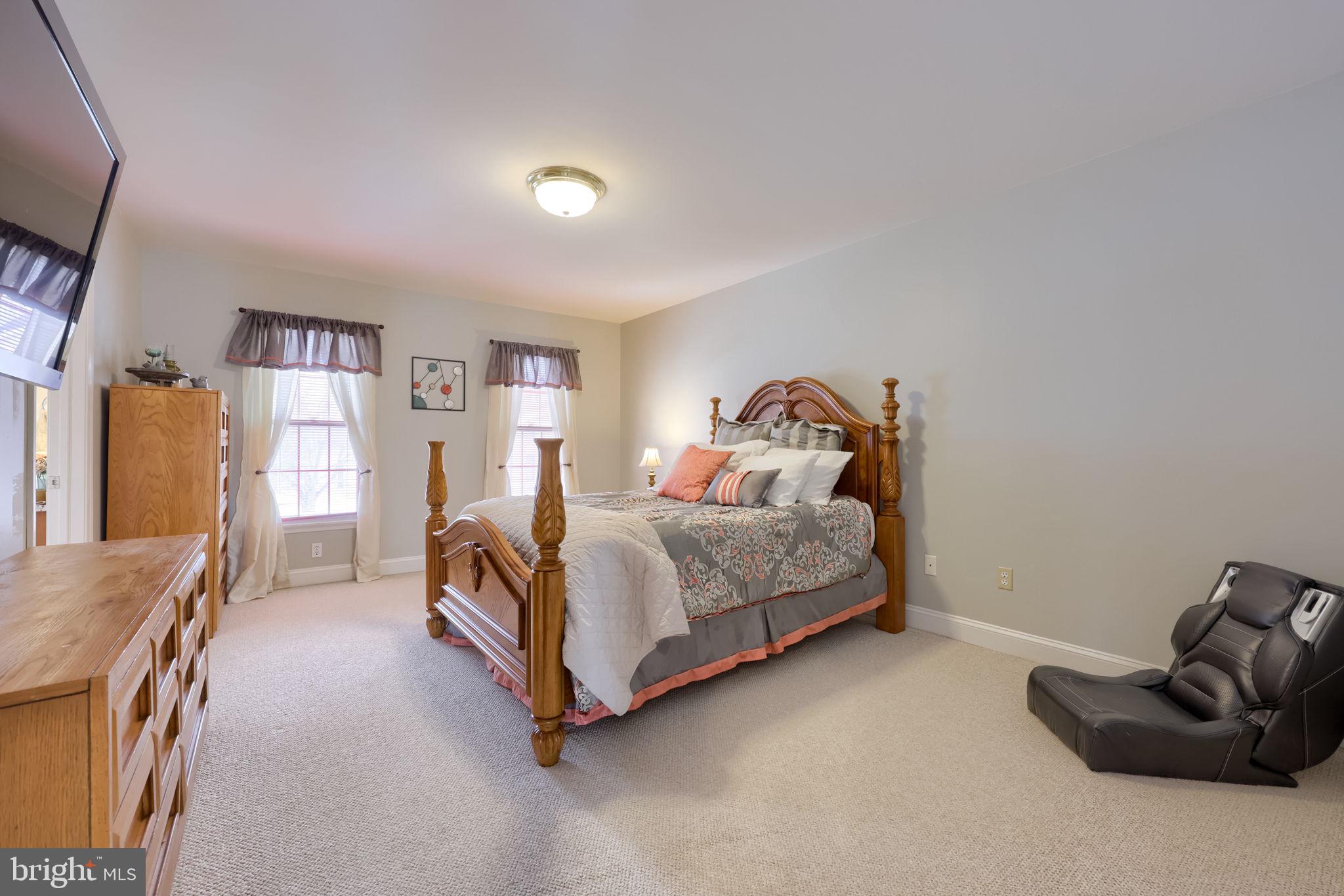 4972 Farmington Road Harrisburg, PA 17112 - Photo 32 of 57 a bedroom with a bed and a couch