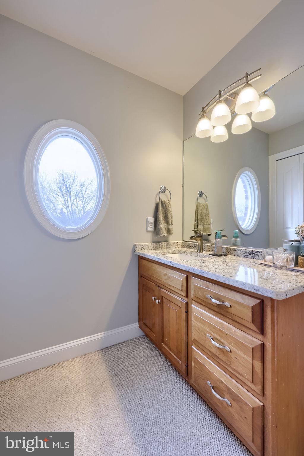 4972 Farmington Road Harrisburg, PA 17112 - Photo 33 of 57 a bathroom with a granite countertop sink and a mirror