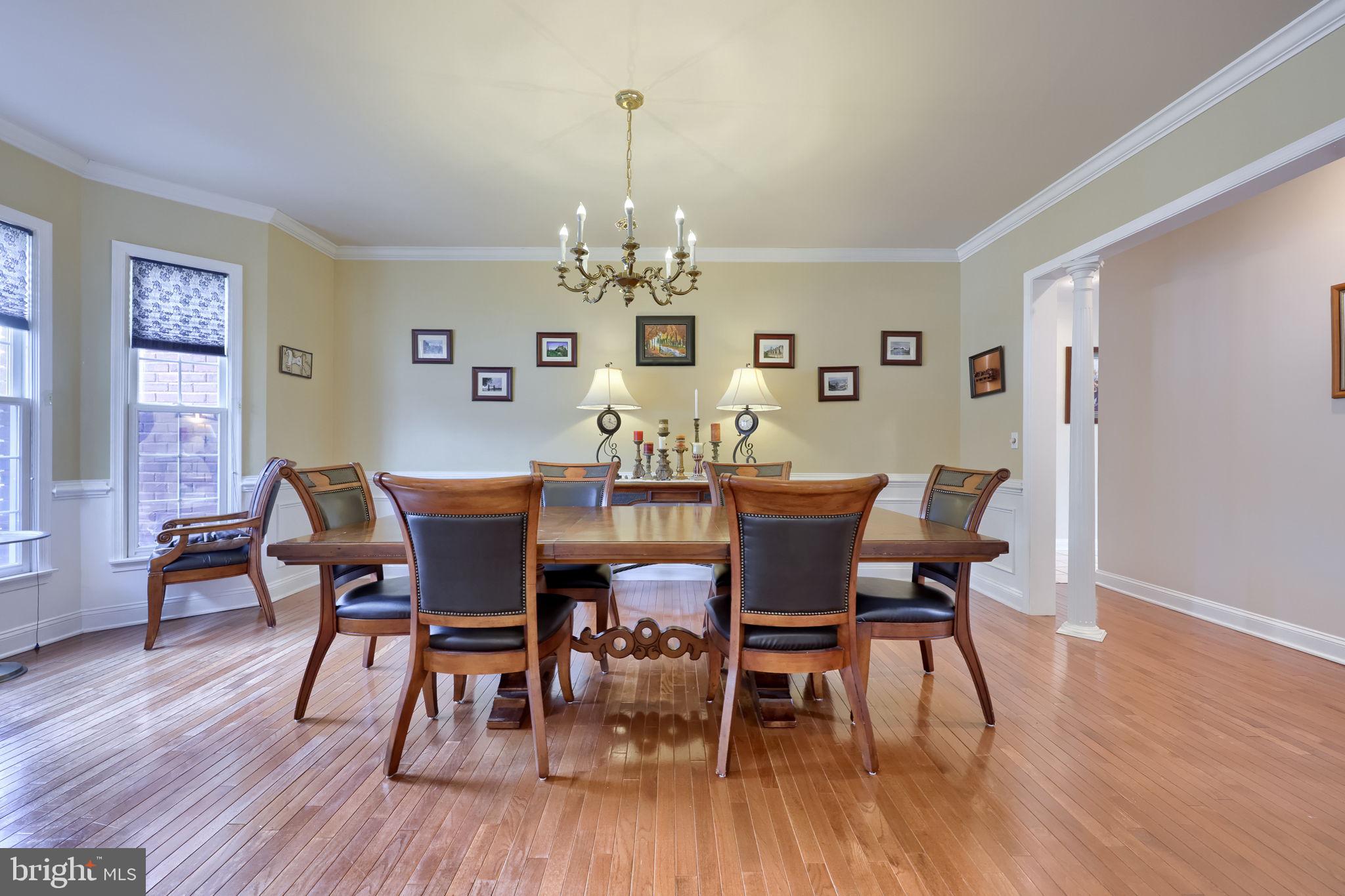 4972 Farmington Road Harrisburg, PA 17112 - Photo 5 of 57 a view of a dining room with furniture wooden floor and a chandelier