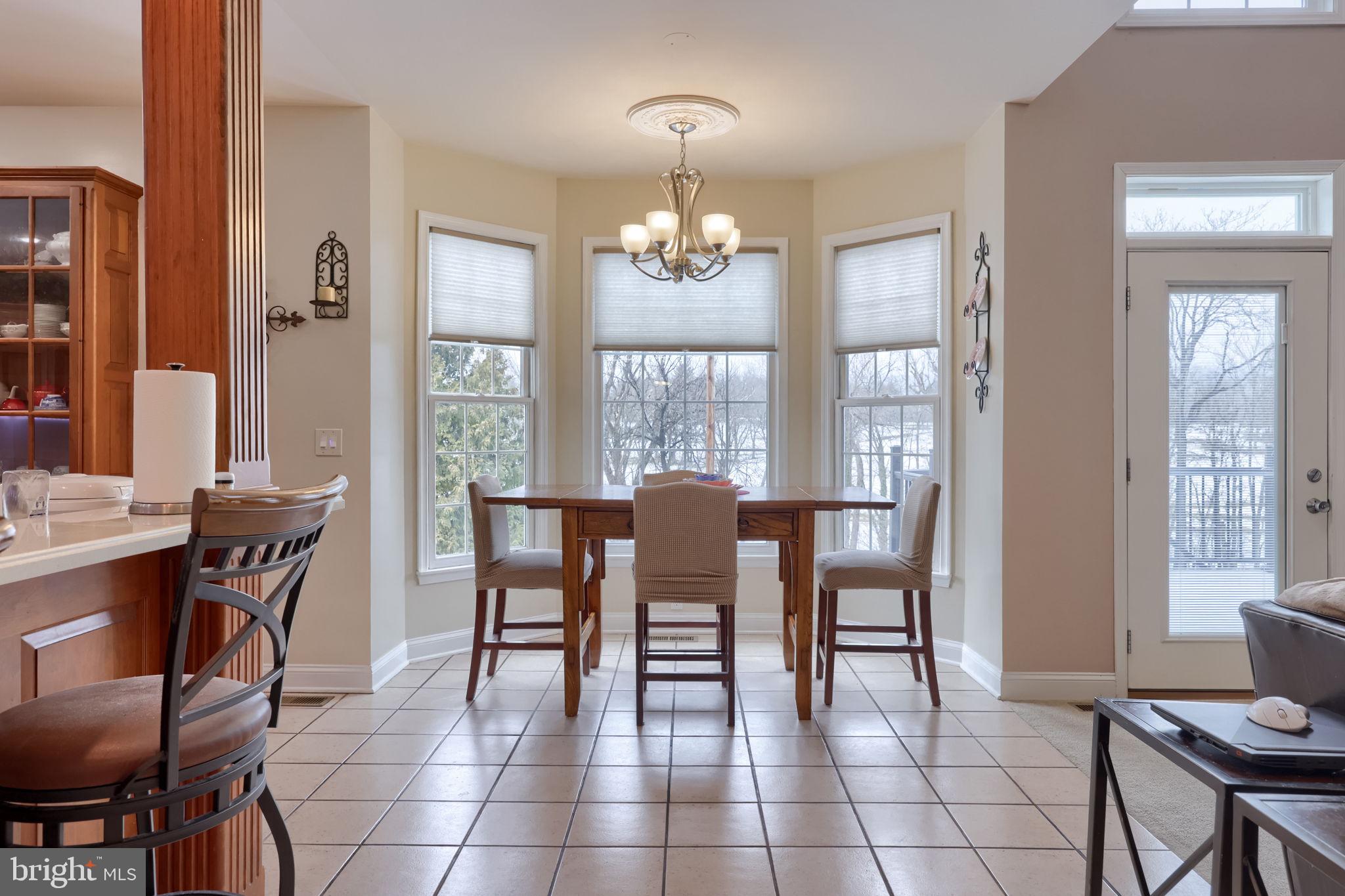 4972 Farmington Road Harrisburg, PA 17112 - Photo 10 of 57 a view of a dining room with furniture and chandelier