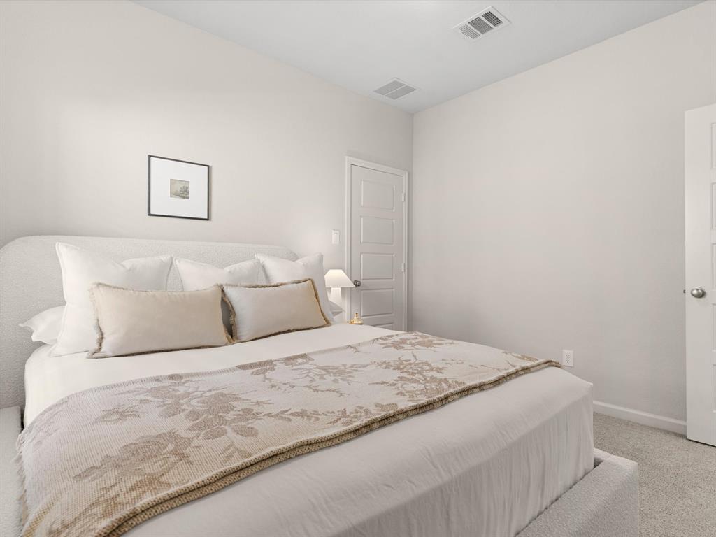 166 Palo Duro Bend Rhome, TX 76078 - Photo 26 of 40 Secondary bedroom suitable for guests, family members, or a home office.