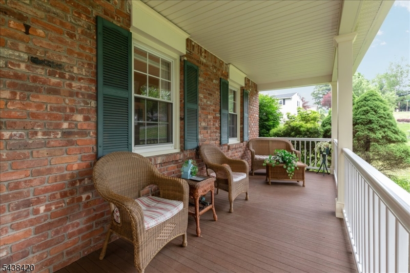 79 Main Street Califon, NJ 07830 - Photo 3 of 50 a view of two chairs in the balcony