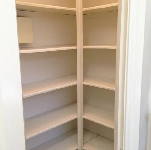 a bathroom with a granite countertop sink and a window