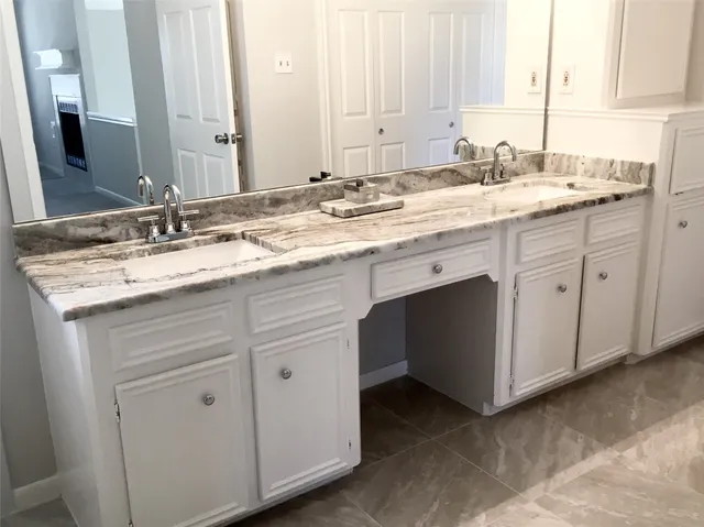 a view of a small space with wooden floor and shower