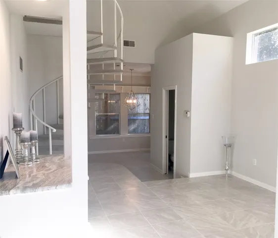 a view of a room with a glass door