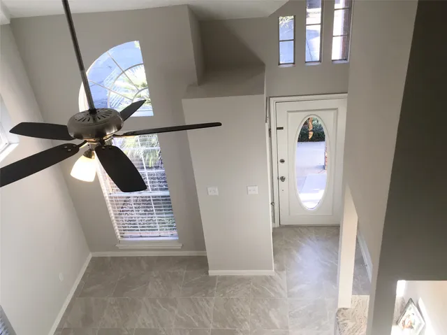 a view of empty room with windows