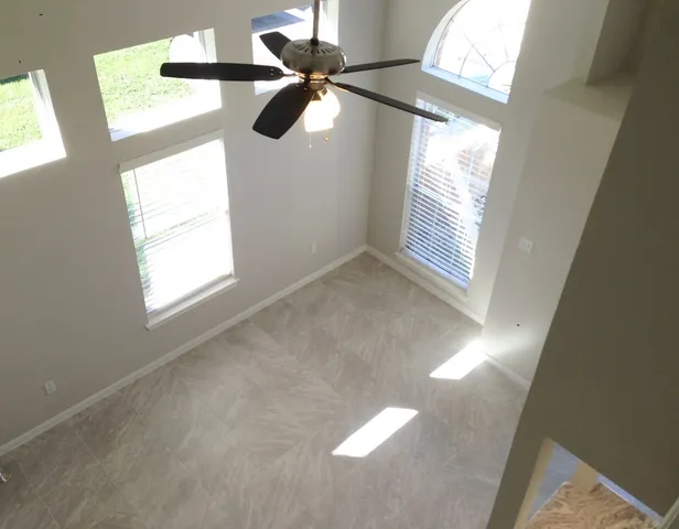 a kitchen sink with a granite countertop window