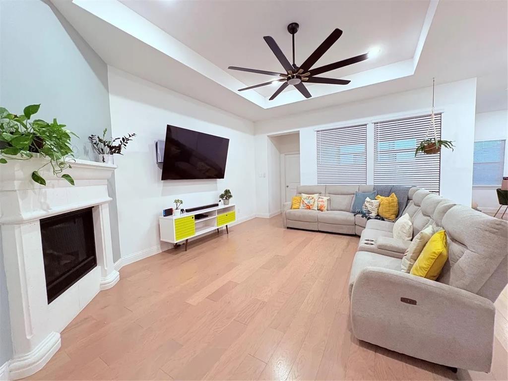 809 Elizabeth Street Anna, TX 75409 - Photo 8 of 13 a living room with furniture and a flat screen tv