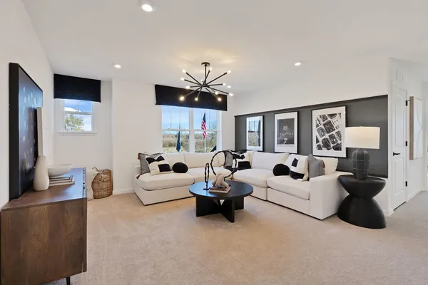 a living room with furniture white walls and white walls