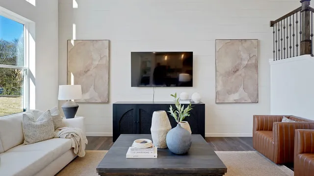 a living room with furniture and a flat screen tv