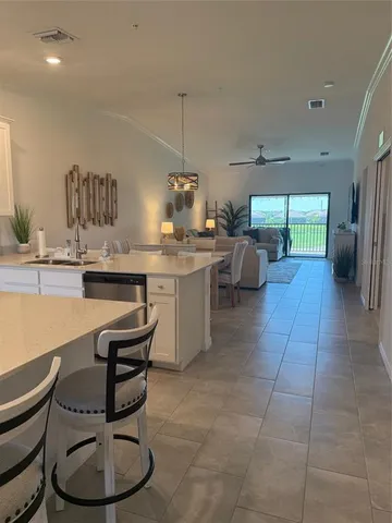a kitchen with a sink and a stove top oven