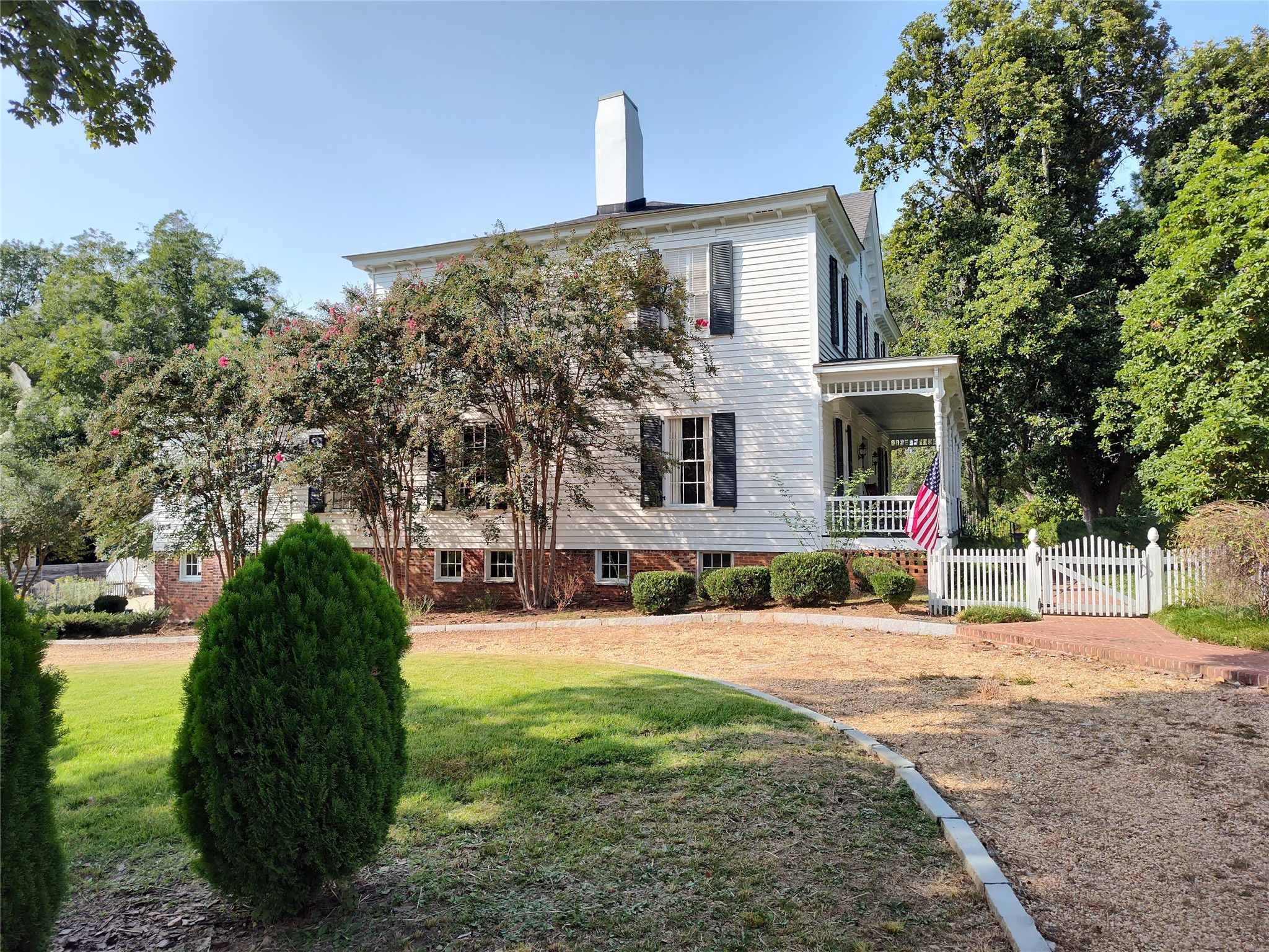 414 Spring Street Washington, GA 30673 - Photo 40 of 42 a front view of a house with a yard