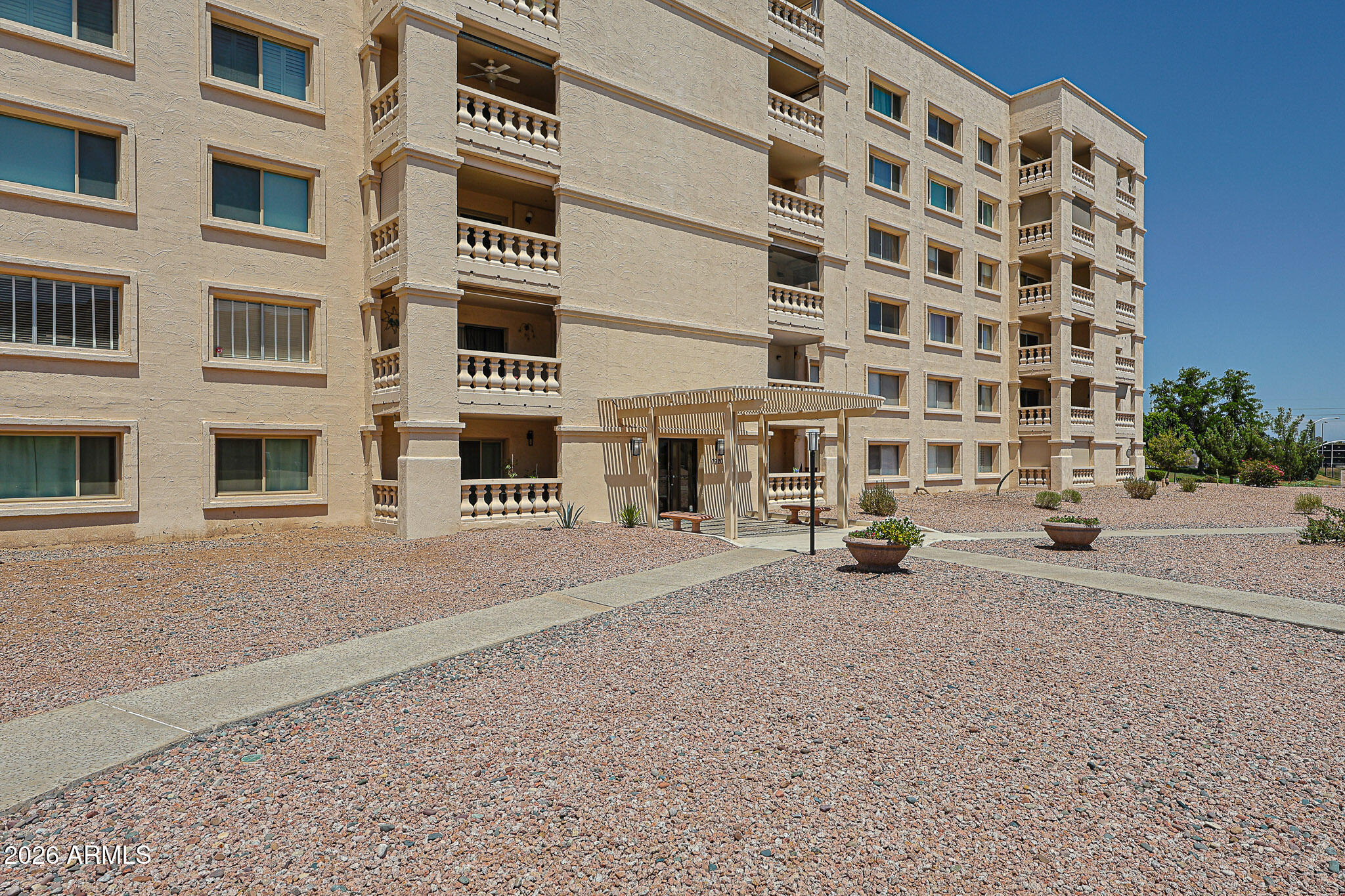 7920 East Camelback Road, Unit 111 Scottsdale, AZ 85251 - Photo 2 of 32 a view of a building with a street