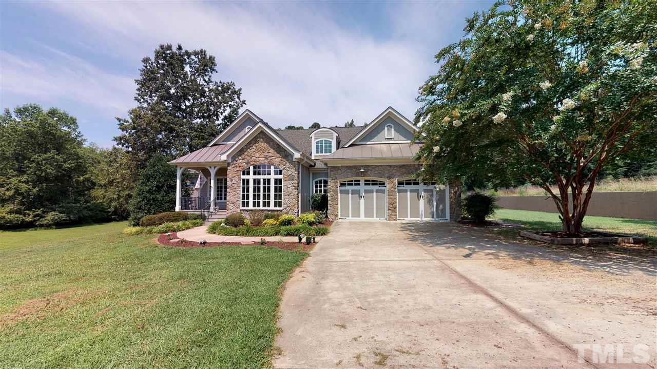 3509 Bahama Road Rougemont, NC 27572 - Photo 1 of 30 a front view of a house with garden