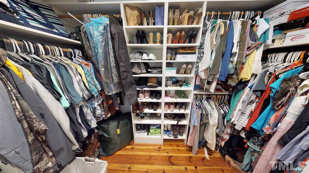 3509 Bahama Road Rougemont, NC 27572 - Photo 12 of 30 a view of walk in closet with clothes and shoes
