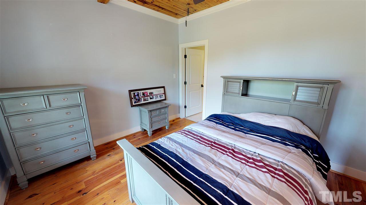 3509 Bahama Road Rougemont, NC 27572 - Photo 13 of 30 a bedroom with a bed and dresser