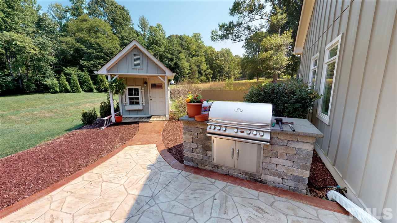 3509 Bahama Road Rougemont, NC 27572 - Photo 24 of 30 a view of a house with a yard