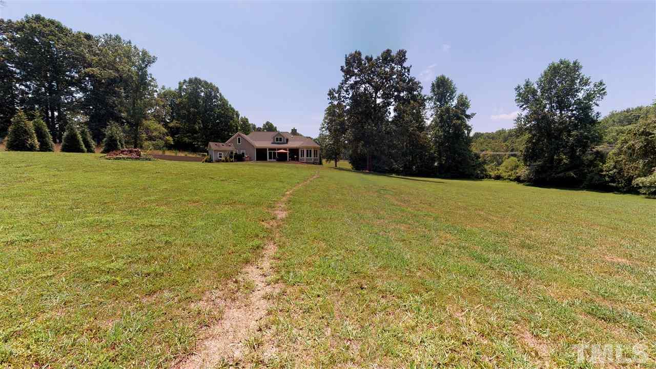 3509 Bahama Road Rougemont, NC 27572 - Photo 29 of 30 a view of a field with trees in the background