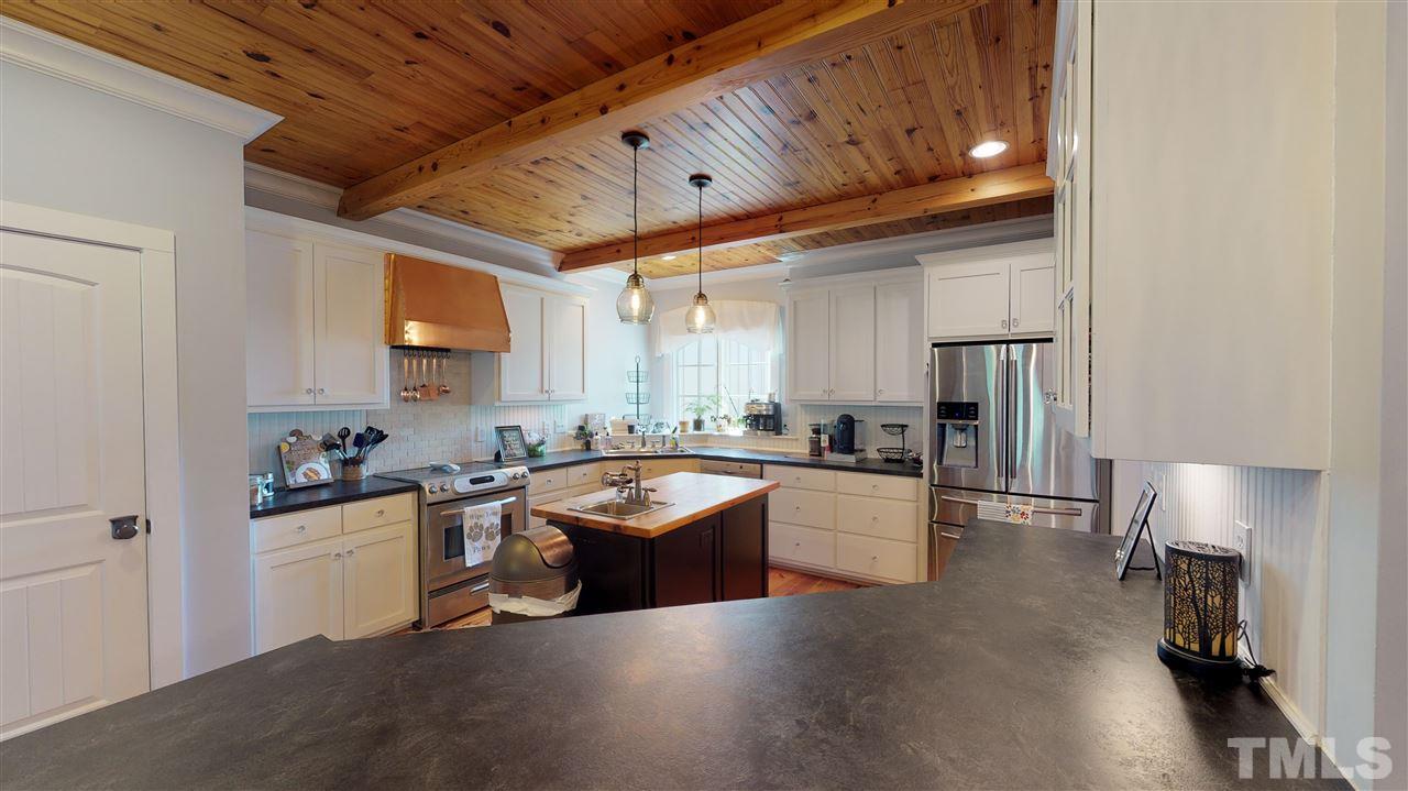 3509 Bahama Road Rougemont, NC 27572 - Photo 6 of 30 a kitchen with granite countertop a sink stove and refrigerator