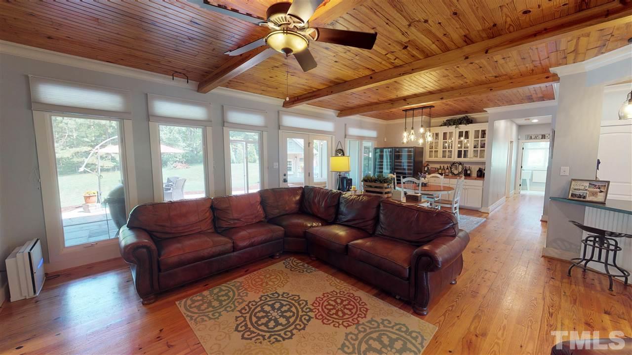 3509 Bahama Road Rougemont, NC 27572 - Photo 8 of 30 a living room with furniture wooden floor and a large window