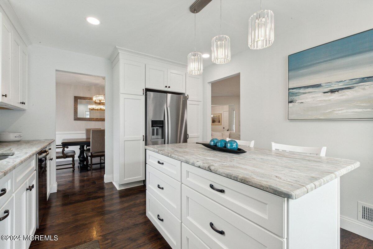 2 Concord Circle Howell, NJ 07731 - Photo 11 of 24 a kitchen with granite countertop white cabinets and stainless steel appliances