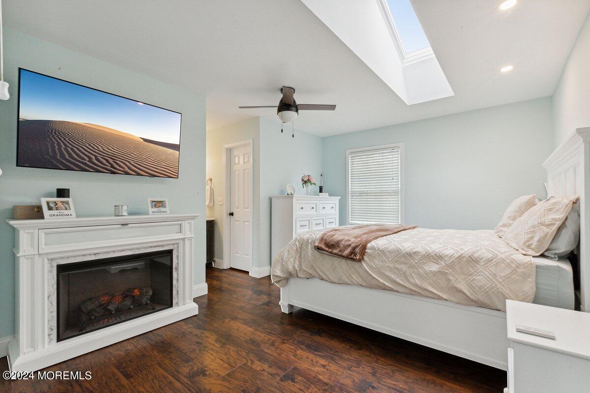 2 Concord Circle Howell, NJ 07731 - Photo 13 of 24 a bedroom with a bed and a fireplace