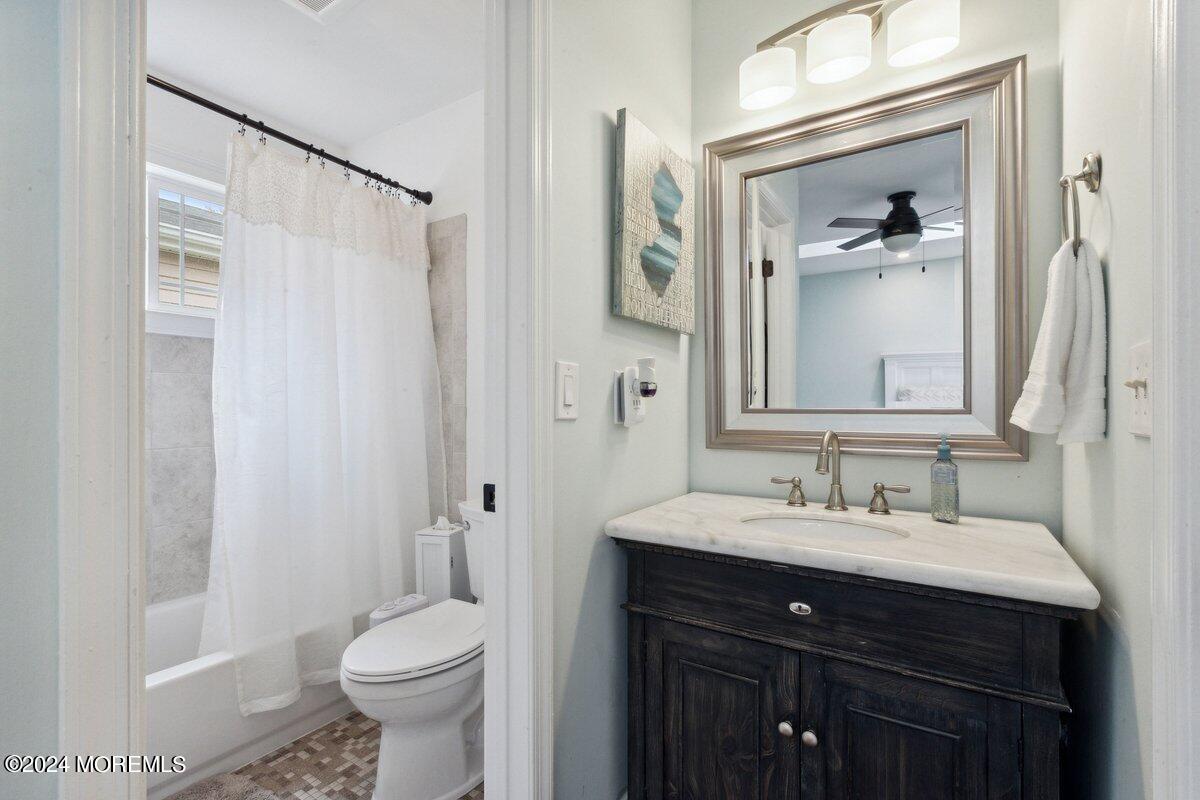 2 Concord Circle Howell, NJ 07731 - Photo 15 of 24 a bathroom with a sink and a mirror