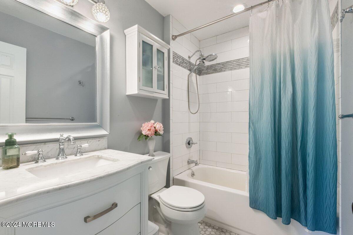 2 Concord Circle Howell, NJ 07731 - Photo 18 of 24 a bathroom with a sink toilet vanity and shower