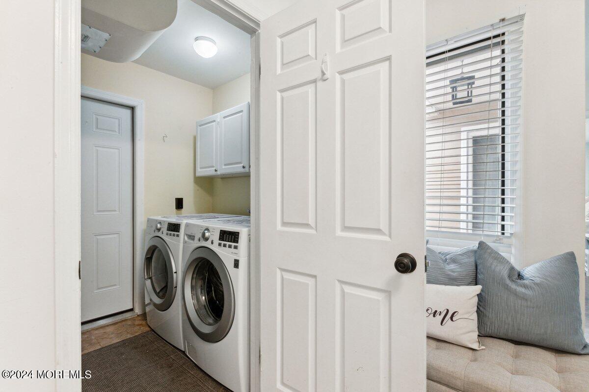2 Concord Circle Howell, NJ 07731 - Photo 19 of 24 a view of a livingroom with washer and dryer