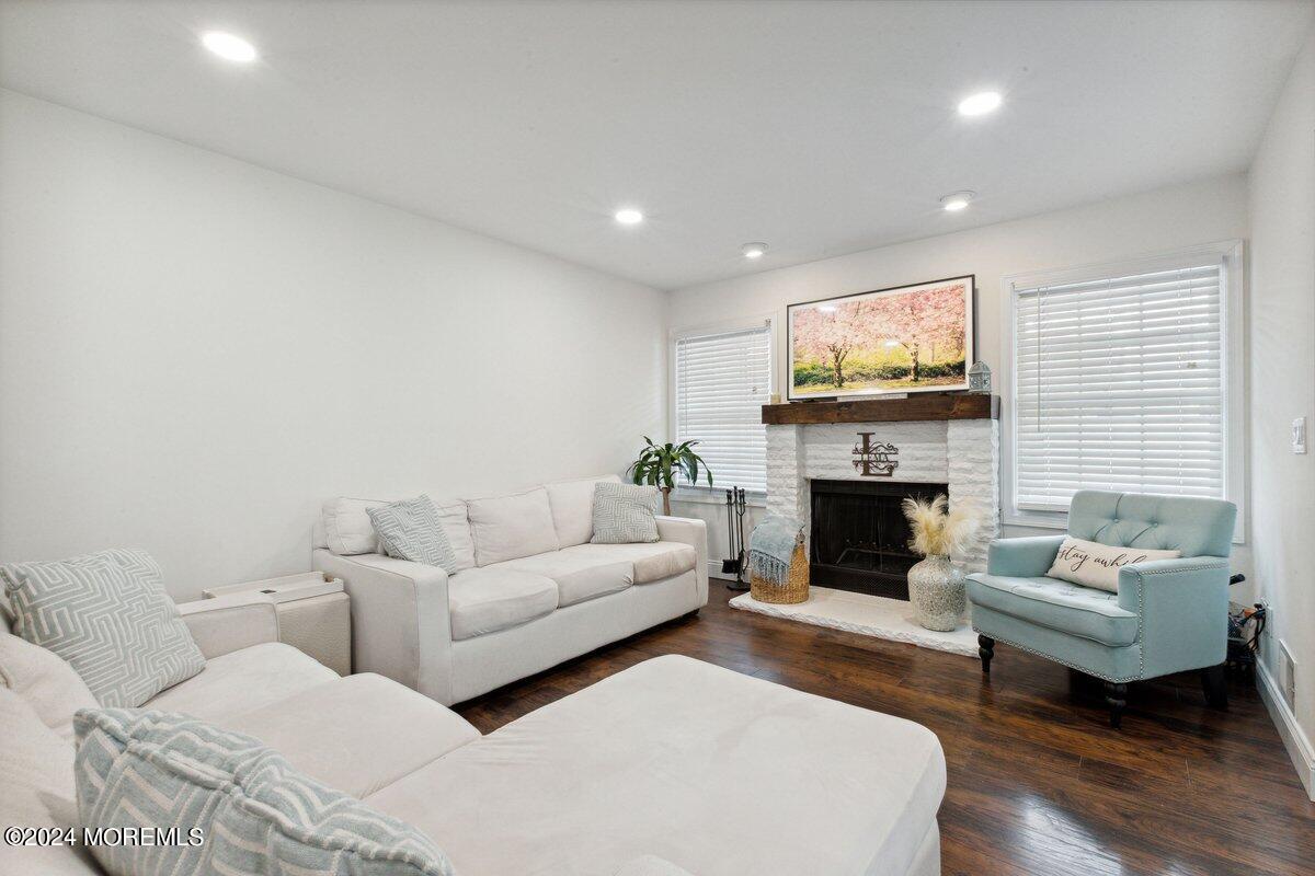 2 Concord Circle Howell, NJ 07731 - Photo 7 of 24 a living room with fireplace furniture and a flat screen tv