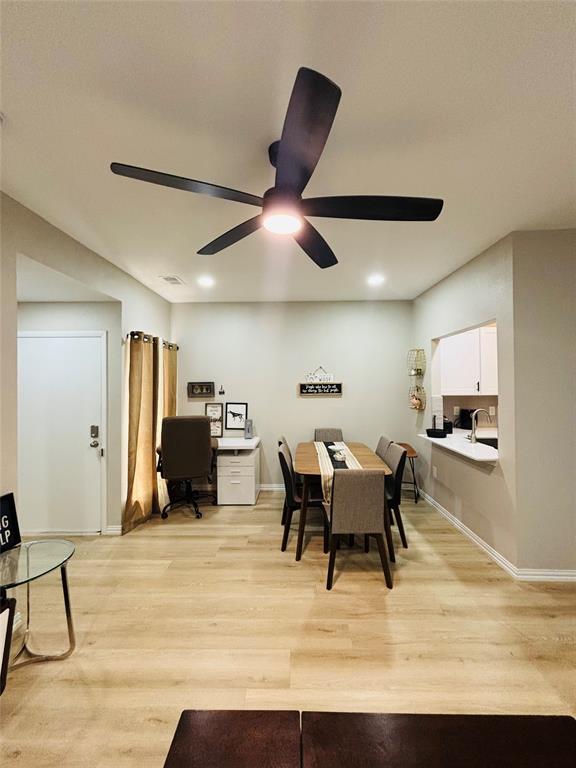 14277 Preston Road, Unit 416 Dallas, TX 75254 - Photo 29 of 40 Recessed ceiling lighting, wood-finish flooring, ceiling fan, white trim, and a pass-through window with a countertop