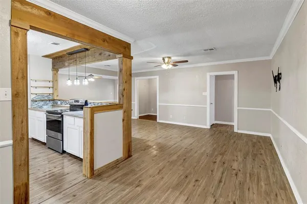 a view of kitchen with sink and wooden floor